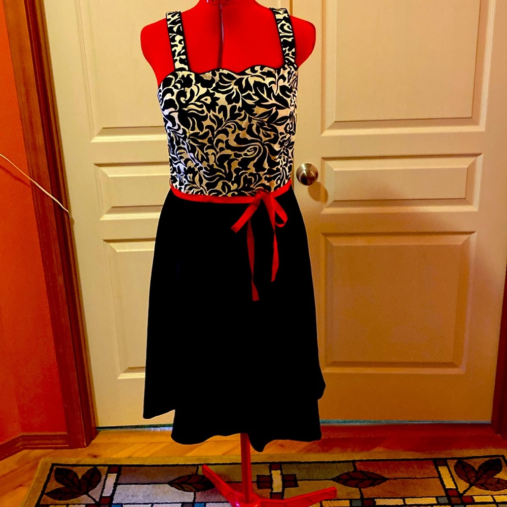 Scalloped front and smock back black and white sun dress.